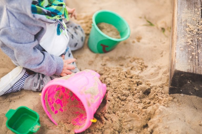little boy playing in the sand 6459 768x512