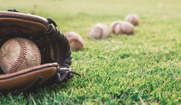 balls baseball glove grass 1661950 1 768x446